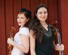 Ellinor & Leonor in front of a red wall, 2013